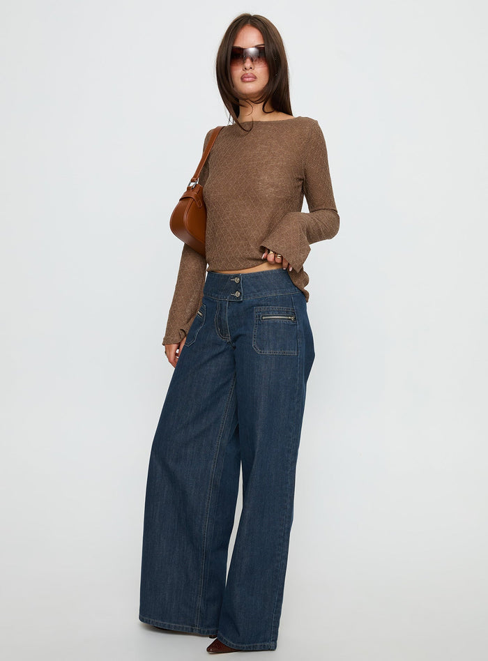 side view of model wearing Princess Polly Unwritten Mid Rise Wide Leg Jeans Dark Blue Wash Mid Rise Jeans