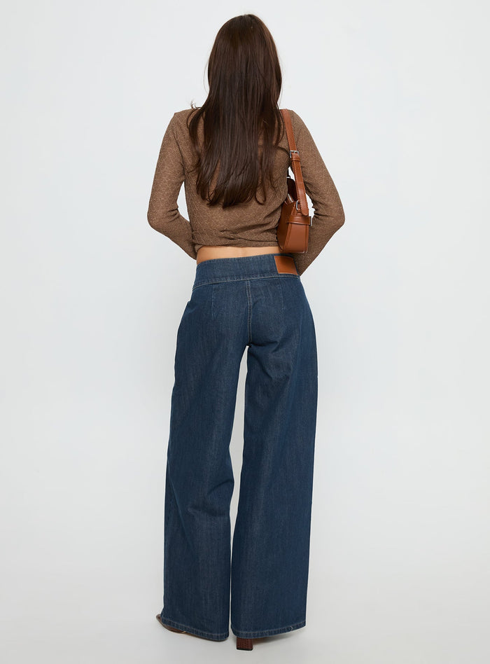 back view of model wearing Princess Polly Unwritten Mid Rise Wide Leg Jeans Dark Blue Wash Mid Rise Jeans