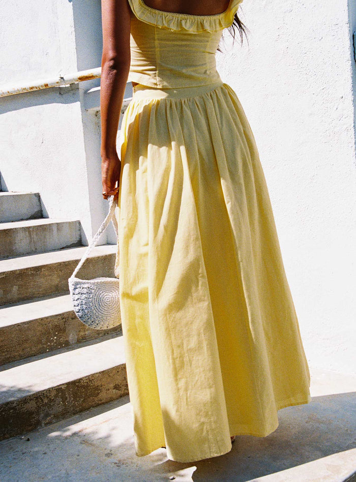 back view of model wearing Princess Polly Valerio Maxi Skirt Yellow Maxi