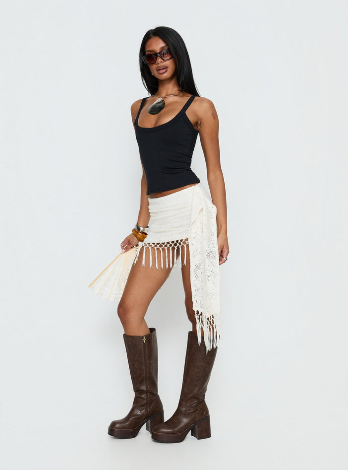 side view of model wearing Princess Polly Winita Macrame Tassel Mini Skirt Cream Mini Skirts Skirts