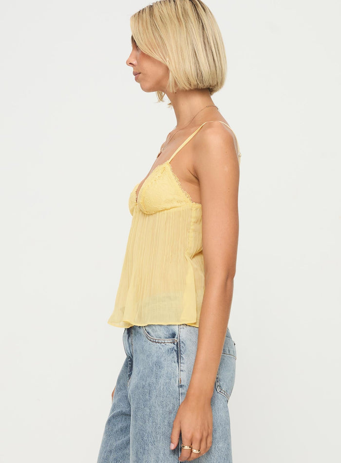 side view of model wearing Princess Polly Zami Pleat Top Lemon Sleeveless Plunger