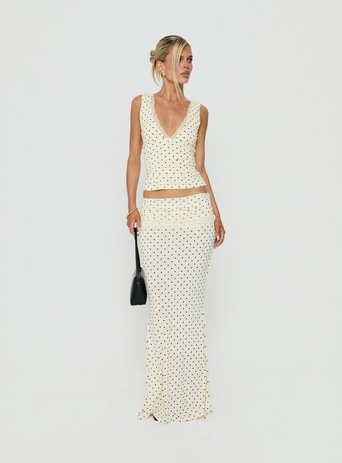 Crafted from jersey fabric the Zespri Maxi Skirt in Cream Polka Dot for womens-skirts with fitted a-line shape and lace hem front view of model wearing Princess Polly