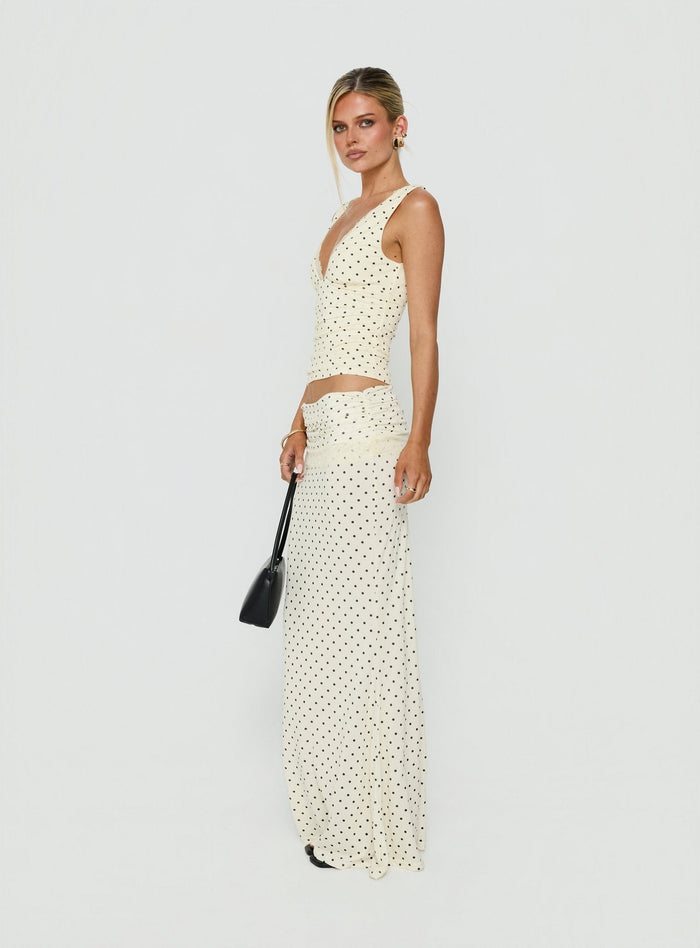 Showcasing the Zespri Jersey Maxi Skirt Cream Polka Dot womens-skirts featuring maxi length side view of model wearing Princess Polly